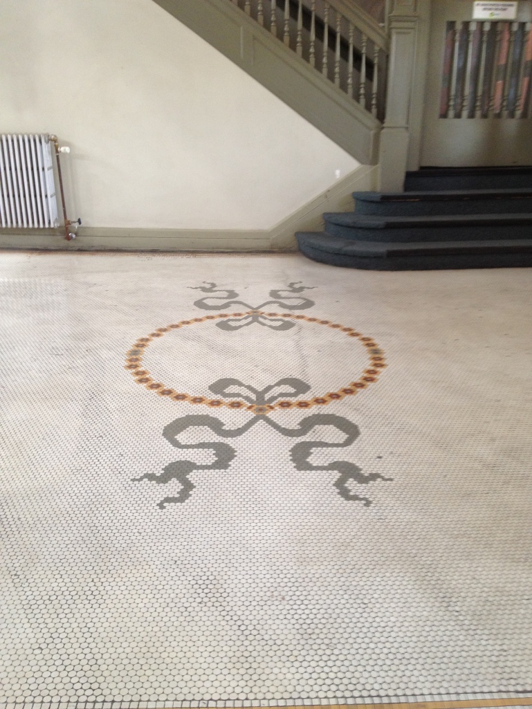floor mosaic at the sides of the station hall